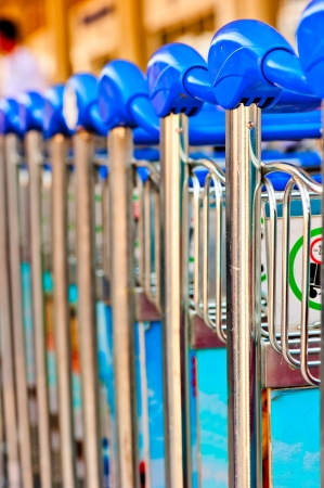 luggage carts at the airport closeupの写真素材