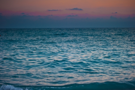 surging sea at dawn and gloomy skyの写真素材