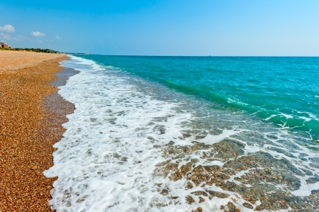 sandy beach and turquoise sea waterの写真素材