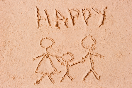 happy family is drawn in the sandの写真素材