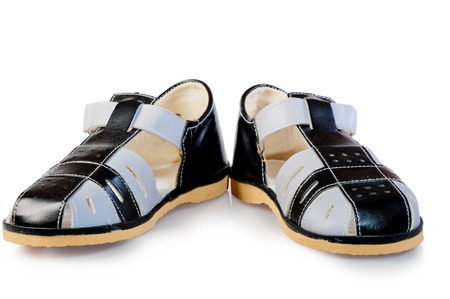 pair of leather sandals for children isolated on white backgroundの写真素材