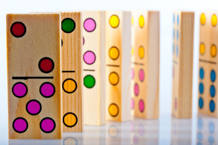 Children's wooden dominoes with colored dotsの写真素材