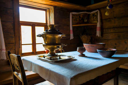 brass samovar on the table in the Russian hutのeditorial素材