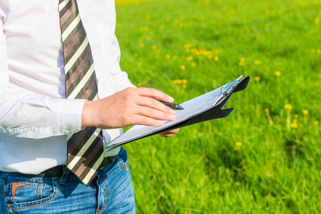 Director signs a contract in the fieldの写真素材