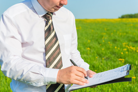 Director puts his signature on important documents の写真素材