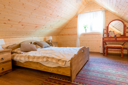 interior bedroom in a wooden farmhouseの写真素材