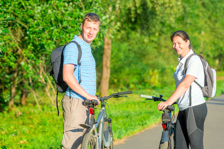 happy young people riding bikesの写真素材