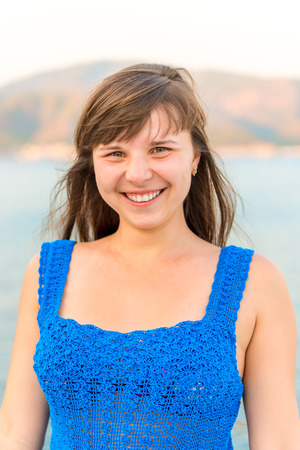 portrait of a young brunette on background of the seaの写真素材