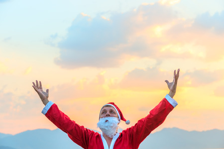 Santa Claus raised his hands to the skyの写真素材