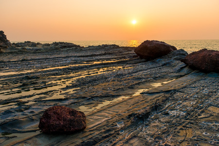 beautiful sunset over the sea and rocky