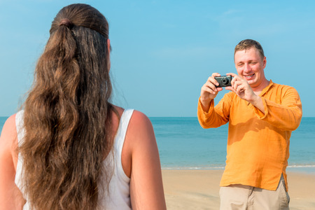 man makes a picture of his girlfriendの写真素材