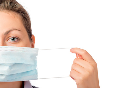 female face close-up and medical mask isolated