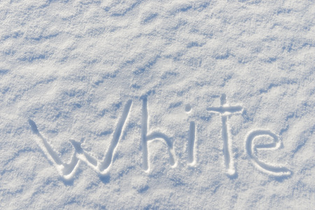 on the snow surface is written the word whiteの写真素材