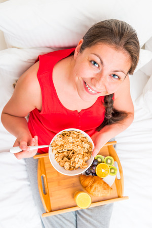have breakfast cute woman smiling, view from aboveの写真素材