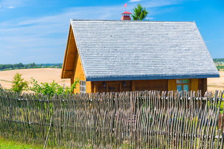 view of the wooden village house in sunny summer dayの写真素材