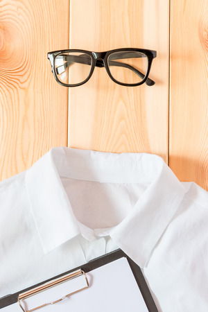 glasses and shirt, business accessories close upの写真素材