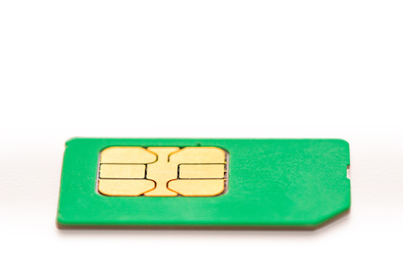 sim card for mobile phone closeup on white backgroundの写真素材