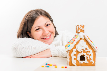portrait of happy girl near Gingerbread Houseの写真素材