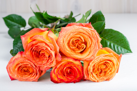 beautiful bouquet of roses for mothers day on white tableの写真素材