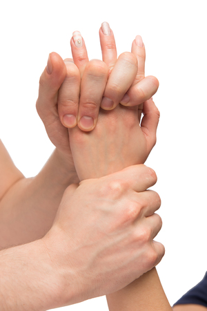 female hand in the hands of a professional masseur isolatedの写真素材