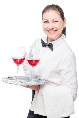 successful waitress with alcohol in glasses on a tray on a white background isolatedの写真素材