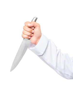 man's hand firmly holding a sharp knife close up on white backgroundの写真素材