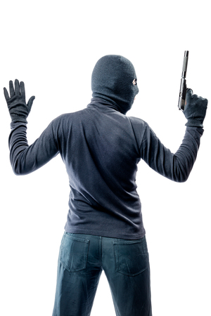 Criminal terrorist with hands up isolated on white backgroundの写真素材