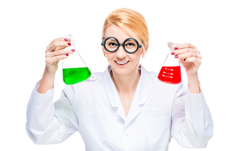 Blond chemist holds a test tube with a colored liquid on a white background