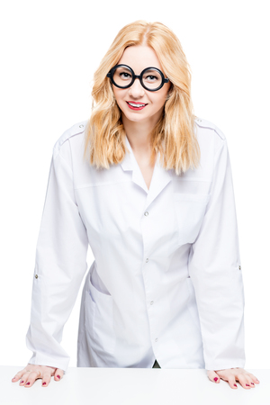 Portrait of a blond doctor with funny glasses on a white backgroundの写真素材