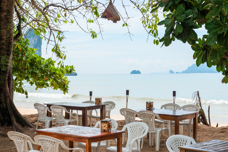 on the shores of the sea tables and chairs in the restaurant in the open air. Thailandの写真素材
