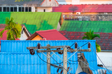 The top view of the roofs of the houses and the high-voltage lineの写真素材