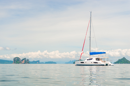 horizontal toned photo - white yacht in the bay of the Andaman Sea, Thailandの写真素材