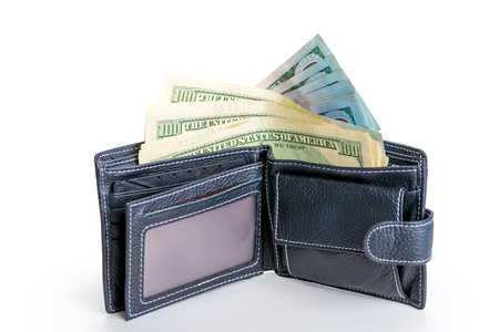 leather black wallet full of 100 dollar bills on a white background isolatedの写真素材