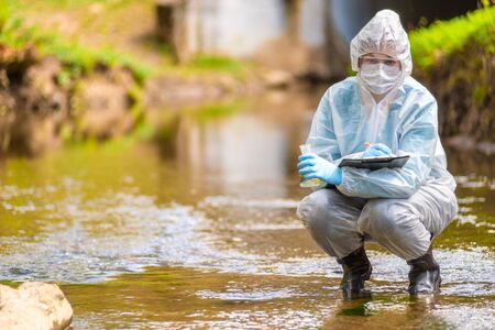 environmental disaster, the profession of an ecologist scientist portrait while workingの写真素材