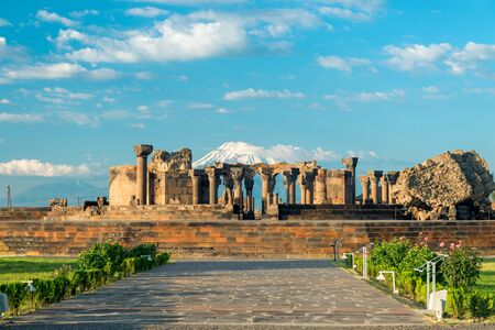 Zvartnots temple, ruins on a sunny day on the background of Mount Ararat - a tourist attraction of Armeniaの写真素材