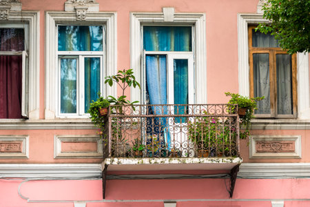 Picturesque balcony house with flowers on terraceの写真素材