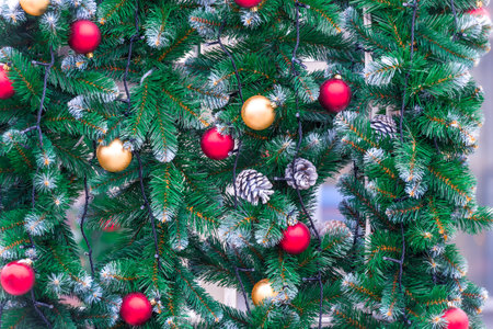 Beautiful festive Christmas trees with toys for the New Year decoratedの写真素材