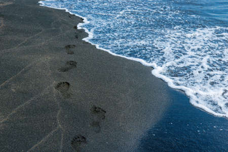 close-up of footprints in the sand on the beachの写真素材