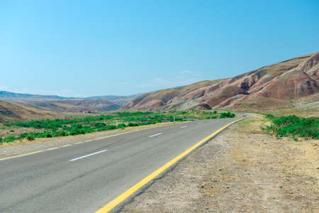 Cross-bedding in Candy Cane Mountains in Azerbaijan and road. Colorful stripes of the hills. Shale striped mountainsの写真素材