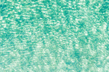 Ripple Water in swimming pool with sun reflectionの写真素材