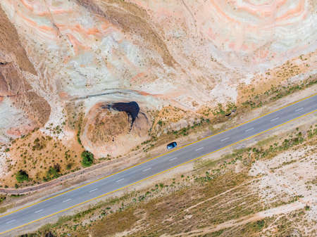 Cross-bedding in Candy Cane Mountains in Azerbaijan and road. Colorful stripes of the hills. Aerial view.の写真素材
