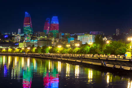 Baku panorama. Night city. Beautiful evening view of skyscrapers. Flame Towers in the evening. Modern architecture. Azerbaijan capital. Night view of Baku.の写真素材
