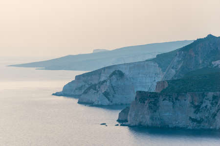 coastline with sea, mountains, canyon and cliffs with sunset light, Greeceの写真素材