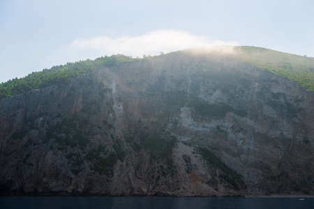 rocky coast of greek island and sea view, landscape greece view from boatの写真素材