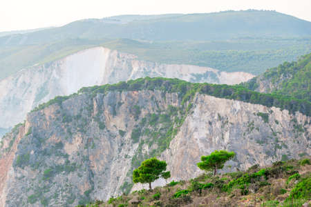 coastline with sea, mountains, canyon and cliffs with sunset light, Greeceの写真素材