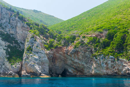 rocky coast of greek island and sea view, landscape greece view from boatの写真素材