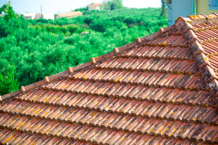 Dark brown concrete roof tiles close-upの写真素材
