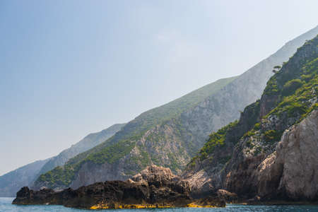 rocky coast of greek island and sea view, landscape greece view from boatの写真素材