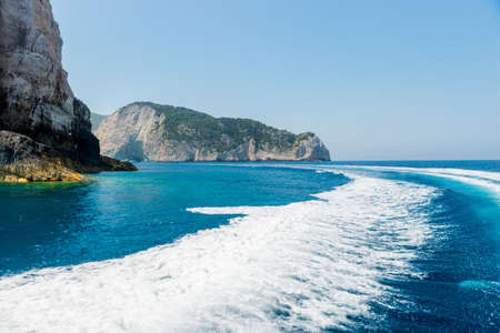 Tail wake on the water from the speedboat on a sunny day.の写真素材