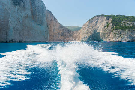 Tail wake on the water from the speedboat on a sunny day.の写真素材